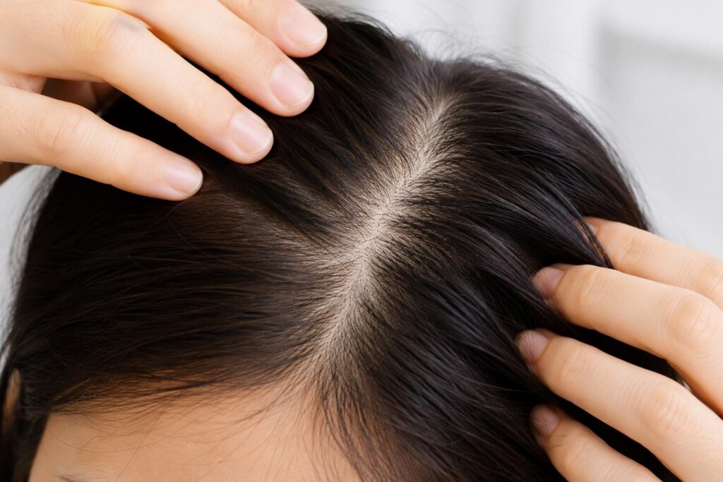 checking scalp texture for dryness and oiliness